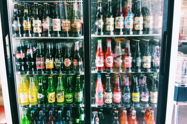 bottles-arranged-refrigerator-store-sale