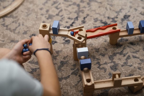 boy-playing-with-his-toys-indoors